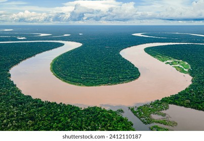 Aerial view of the Amazon River winding through dense forests in Amazonas, Colombia - Powered by Shutterstock