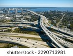 Aerial view of american freeway intersection with fast moving cars and trucks. USA transportation infrastructure concept