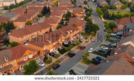 Aerial view: American suburb, serene Canadian suburban scenery. Suburban landscape, epitomizing North American suburban life, tranquility, and charm. Ideal for suburban-themed projects.