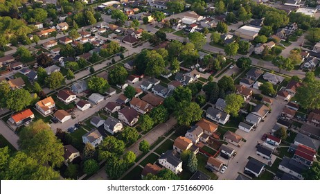 Aerial View Of American Suburb At Summertime.  Establishing Shot Of American Neighborhood. Real Estate, Residential Houses. Drone Shot, From Above