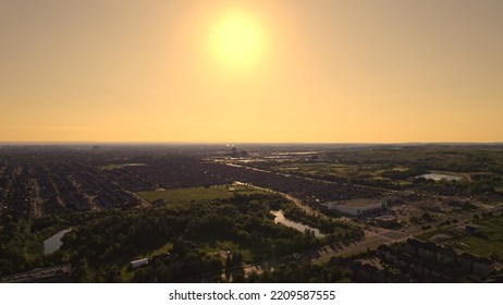 Aerial view of American suburban neighbourhood. Residential single American family houses. North America suburb streets. Established Real estate at golden hour sunset with long shadows. - Shutterstock ID 2209587555