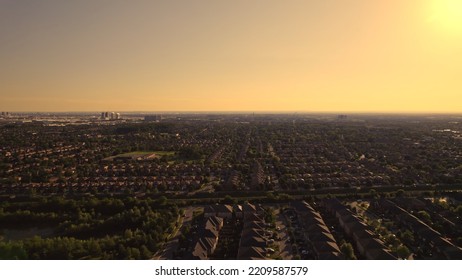 Aerial view of American suburban neighbourhood. Residential single American family houses. North America suburb streets. Established Real estate at golden hour sunset with long shadows. - Shutterstock ID 2209587579