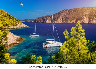 Aerial View Of Anchored Sailing Yacht In Emerald Sea. Aerial View Of A Boat. Outdoor Water Sports, Yachting. Aerial View Of Anchoring Yacht In Open Water. Ocean And Sea Travel And Transportation