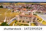 Aerial view of ancient Castle of Dukes of Alburquerque on background with Cuellar cityscape in summer day, Spain