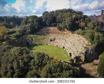 Aerial view of ancient roman stone amphitheater  in the town of Sutri near Rome in Italy - Shutterstock ID 2081551765