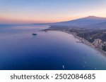 Aerial view of the Ancient theater of Taormina with Mount Etna in the background, Sicily, Italy