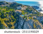 Aerial view of the Ancient theater of Taormina with Mount Etna in the background, Sicily, Italy