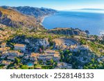 Aerial view of the Ancient theater of Taormina with Mount Etna in the background, Sicily, Italy