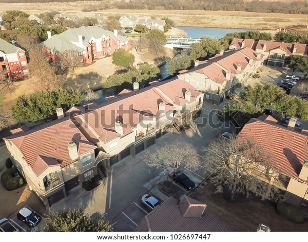 Aerial view apartment buildings complex near\
canal in Irving, Texas, USA,\
wintertime.