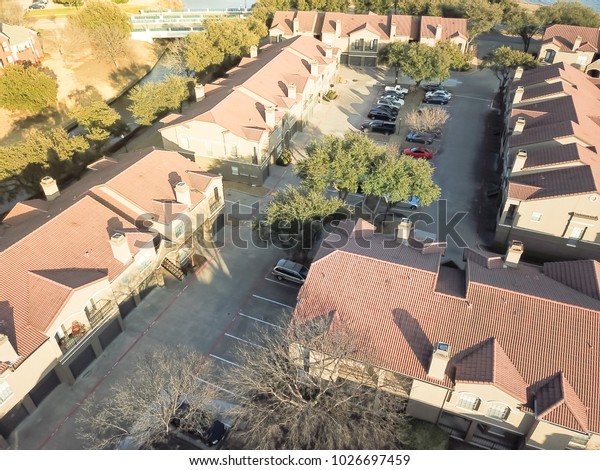 Aerial view apartment buildings complex near\
canal in Irving, Texas, USA,\
wintertime.