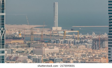 Aerial View Of Apartment Houses And Villas In Dubai City Timelapse From Skyscraper In Financial District, United Arab Emirates. Tower Under Construction In Port