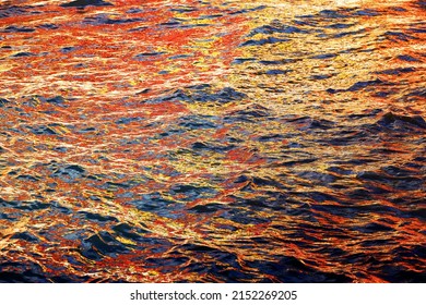 Aerial View Of Aquamarine Sea Surface  With Coloutful Buildings Of Vernazza Reflected On It. Rough Sea Texture. Top View Natural Background Of Rippled Sea Water Surface