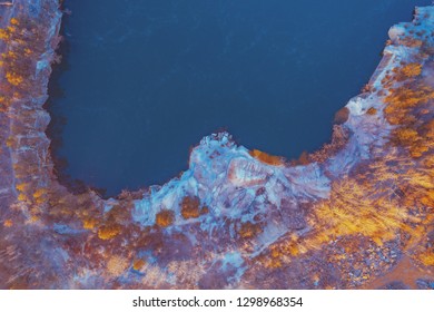 Aerial view of arable fields, trees and countrysides in evening