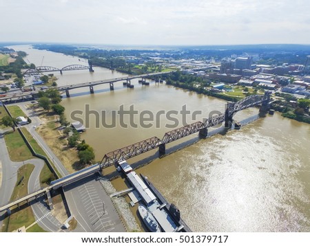 Aerial view Arkansas Inland Maritime Museum with Balao-class submarine along the north side of Arkansas river.  Available are Junction Bridge Pedestrian Walkway, I-30 and Arkansas River Trail Bridge.