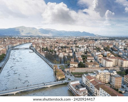 Aerial view of the Arno river during flood, Pisa, Italy.