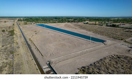 Aerial View Of Artificial Water Reservoir For Agricultural Irrigation.