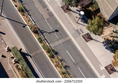 An Aerial View Of Asphalt Urban Road With Bicycle Lanes