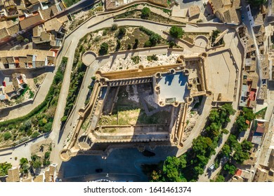 Aerial View Of Atalaya Castle Over Villena Spain. The Fortress Has Concentric Plan, With A Rectangular Barbican Forming Space In Front Of The Keep.  The External Wall Has Chemin-de-ronde Or Wall-walk