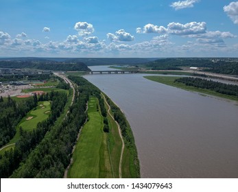 Aerial view of Athabasca River, Golf club, bridge on HWY 63 and town of Fort Mcmurray in Canada