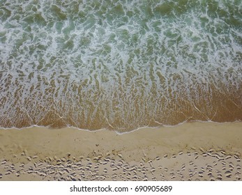 Aerial View Of The Atlantic Ocean Washing Against A Scenic Beach On Cape Cod, Massachusetts. This Sandy New England Peninsula Is A Popular Summer Vacation Destination.