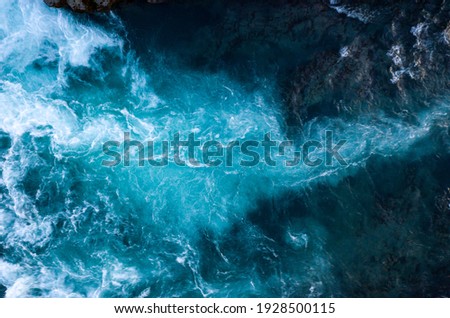 Aerial view of Atlantic ocean waves washing black basaltic sand beach, Iceland