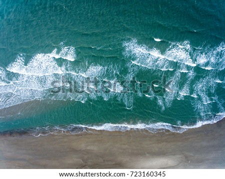 Similar – Aerial Drone View Of Blue Ocean Waves And Beautiful Sandy Beach Shore in Portugal