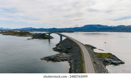 An aerial view of the Atlantic Road bridge in Norway, a scenic route with a unique design that runs through the ocean. - Powered by Shutterstock