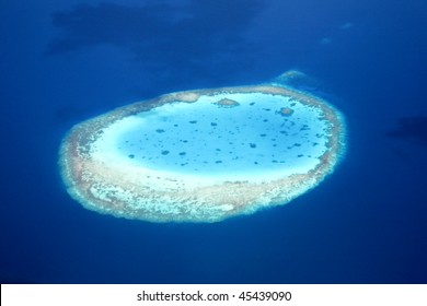 Aerial View Of An Atoll In The Azure Blue South Pacific