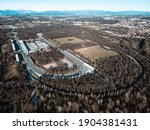 Aerial view of The Autodromo Nazionale of Monza, that is a race track located near the city of Monza, north of Milan, in Italy. Epic drone shot of the circuit in Monza.