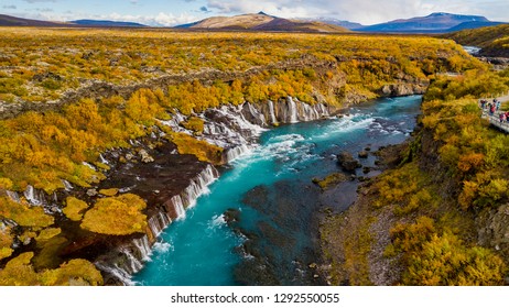 Aerial View of autumn foliage at Hraunfossar Waterfalls in Husafell, West Iceland