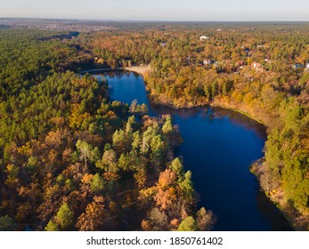 Aerial view of the autumn forest near the river in the afternoon - Shutterstock ID 1850761402