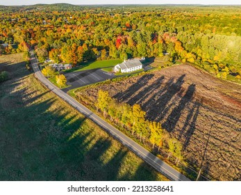 Aerial View Of Autumn Landscape View With Road, Village Church And Tree Shadow