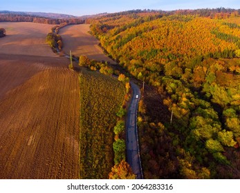 Aerial View Of Autumn Road With Car