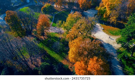 Aerial view of autumn trees in Sempione Park next to the Sforzesco Castle. City and building roofs. View of modern skyscrapers. Ecology. Green planet. Horizon. Milan. Italy, 02.2024 - Powered by Shutterstock