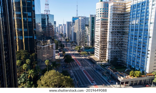 Aerial view of Av. Paulista in São Paulo, SP.\
Main avenue of the capital. Sunday day, without cars, with people\
walking on the street.