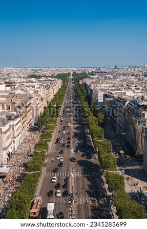 Aerial view of the Avenue des Champs Elysees in Paris with the Arc de Triomphe and Seine River.