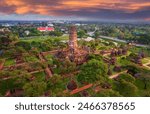 Aerial view of Ayutthaya ancient buddhist temple near the Chao Phraya river in Ayutthaya, Thailand. Old Thai temple on a rainy day.