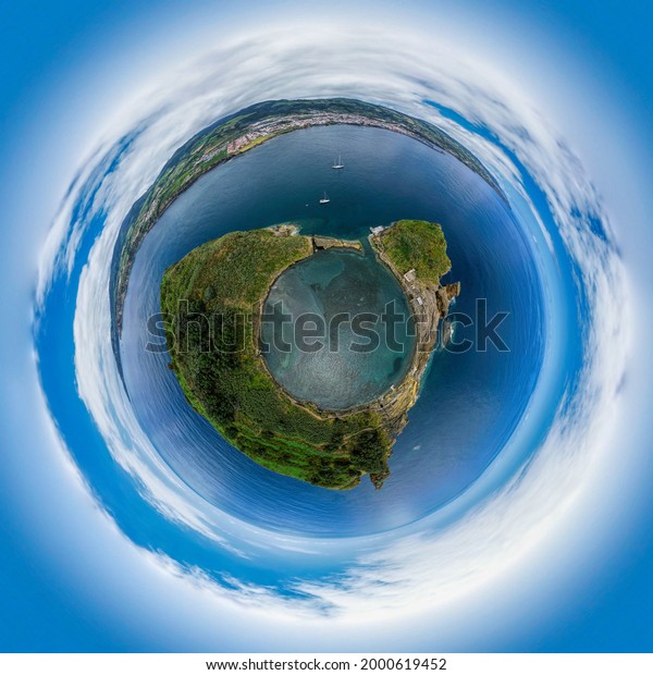 Aerial view of Azores,\
Portugal. Little planet panorama 360 degrees. Drone landscape in a\
Tiny planet image of Vila Franca Islet. Travel destination. Summer\
vacations.