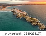 Aerial view of Baleal peninsula near Peniche town on the west coast of Portugal. Drone photo of the rocky Baleal island in Portugal. Portuguese travel and surfing destination.