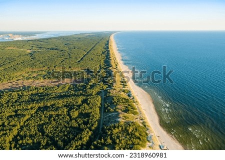 Aerial view of the Baltic Sea shore line near Klaipeda city, Lithuania. Beautiful sea coast on sunny summer day.