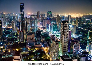 Aerial View Of Bangkok Downtown Skyline At Night, Thailand.