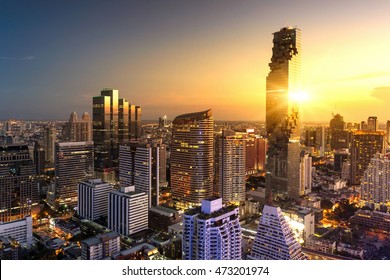 Aerial view of Bangkok modern office buildings, condominium in Bangkok city downtown with sunset sky , Bangkok , Thailand