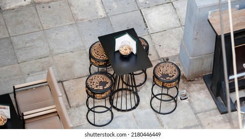 Aerial View Of Bar Stools And Table With Menu - Decoration With Multiple Wine Corks - View Of Thessaloniki Street From Above