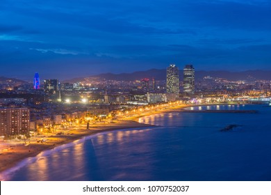 Aerial View Of Barcelona Beach In Summer Night Along Seaside In Barcelona, Spain. Mediterranean Sea In Spain. Europe Tourism, Modern City Life, Or Business Finance And Economy Concept