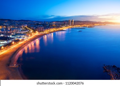 Aerial View Of Barcelona Beach In Summer Night Along Seaside In Barcelona, Spain. Mediterranean Sea In Spain. Europe Tourism, Modern City Life, Or Business Finance And Economy Concept