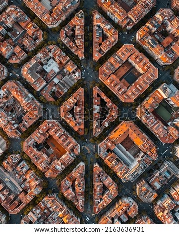 Aerial view of Barcelona city skyline with morning light. Catalonia, Spain. Cityscape with typical urban octagon blocks