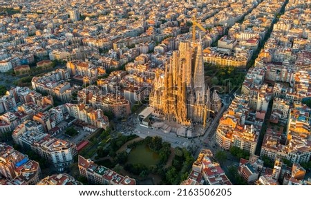 Aerial view of Barcelona Eixample residential district and Sagrada Familia Basilica at sunrise. Catalonia, Spain