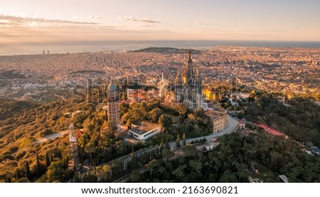 Aerial view of Barcelona skyline with Sagrat Cor temple during sunrise, Catalonia, Spain