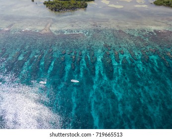 An Aerial View Of The Barrier Reef Along Turneffe Atoll In Belize Reveals Spur And Groove Channels That Exist Near Shore. This Type Of Reef Often Develops On Windward Sides Of Islands.