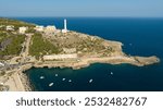 Aerial view of the Basilica Sanctuary of Santa Maria de Finibus Terrae and the Leuca lighthouse on the top of Punta Meliso. They are located in Santa Maria di Leuca in Salento, Puglia, Italy.